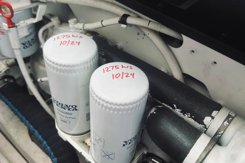 Slide: The Image of Engine compartment of 2007 Sabreline 34 Express with Volvo Penta filters, marked "1275 hrs 10/24". - 71