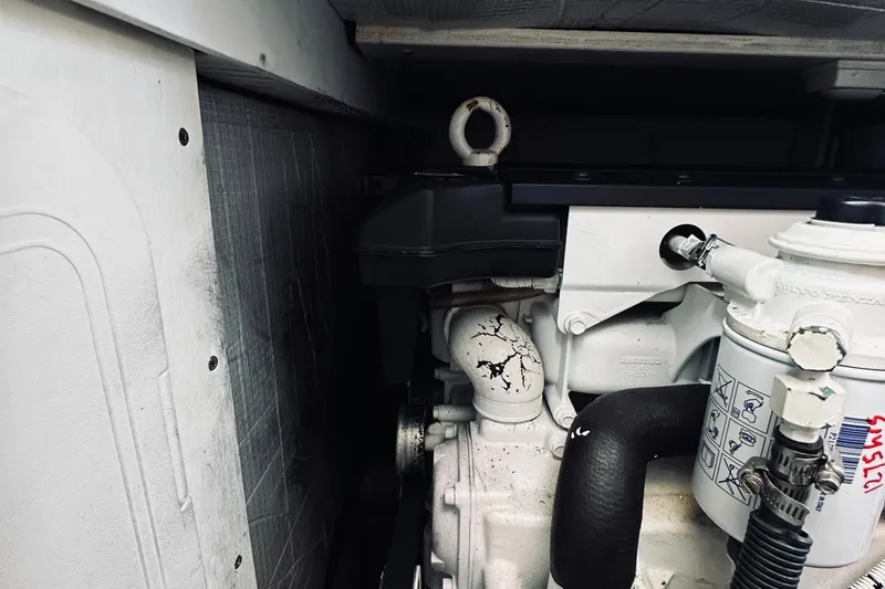 Slide: The Image of Engine compartment of a 2007 Sabreline 34 Express boat, showing mechanical components. - 73