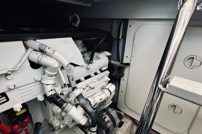 Slide: The Image of Engine compartment of 2007 Sabreline 34 Express boat, featuring detailed mechanical components. - 78