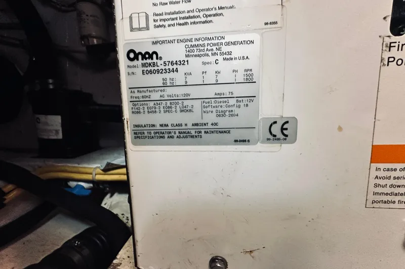 Slide: The Image of Onan generator label inside 2007 Sabreline 34 Express boat engine compartment. - 87