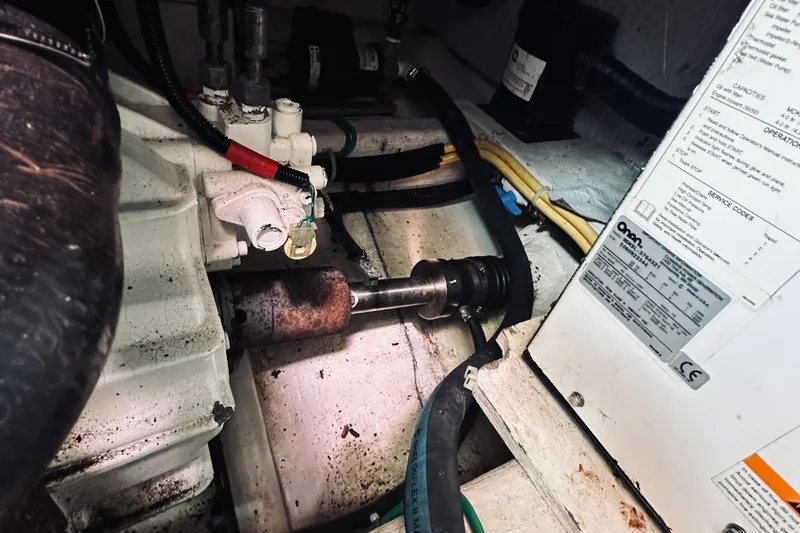 Slide: The Image of Engine compartment of a 2007 Sabreline 34 Express, showing mechanical components and wiring. - 88