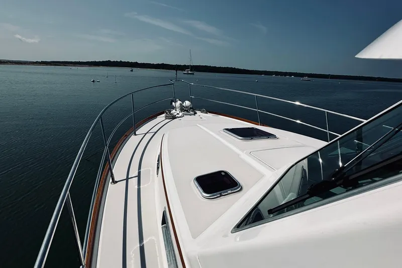 Slide: The Image of 2007 Sabreline 34 Express yacht cruising on calm waters under clear skies. - 96