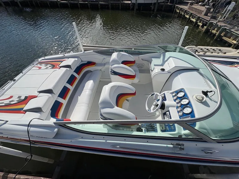 Slide: The Image of 2006 Formula 292 Fast Tech boat with colorful interior, docked by the water. - 3