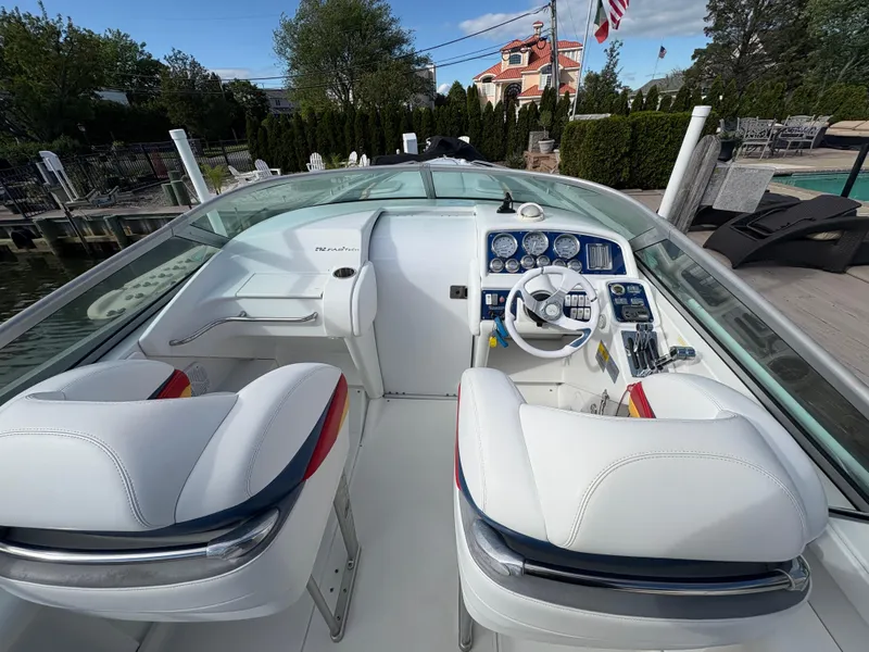 Slide: The Image of Interior of a 2006 Formula 292 Fast Tech boat with white seating and control panel. - 4