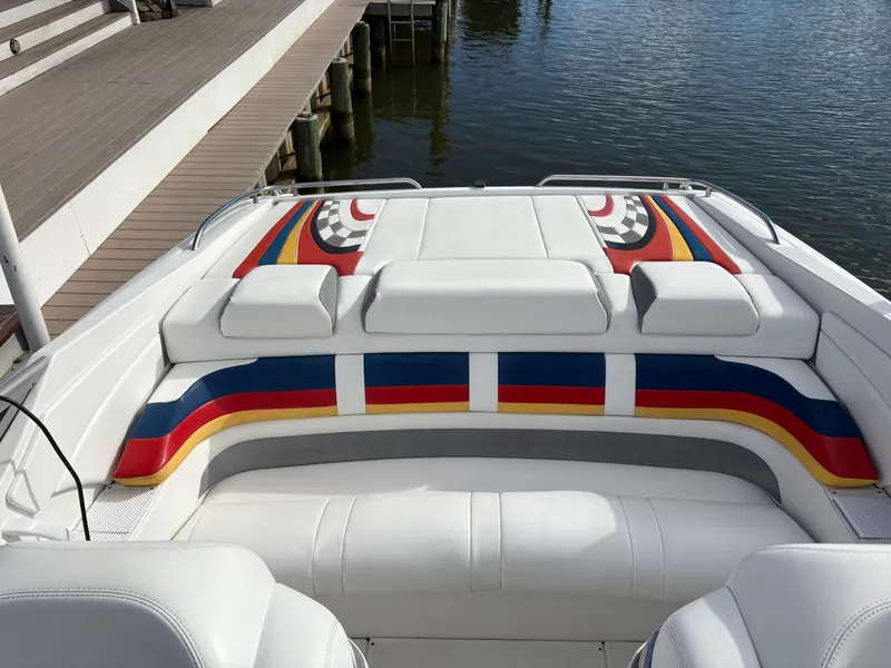 Slide: The Image of 2006 Formula 292 Fast Tech boat with colorful seating design by the dock. - 6