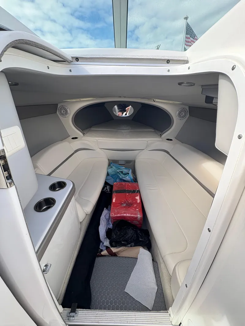 Slide: The Image of 2006 Formula 292 Fast Tech cabin interior with white seating and storage space. - 7