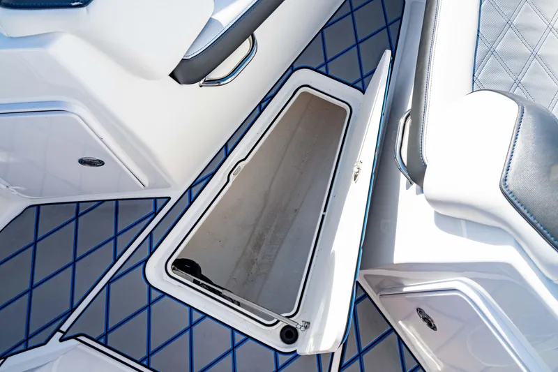 Slide: The Image of 2020 Sunsation 32 CCX boat on calm ocean waters, featuring sleek seating and modern design. - 18