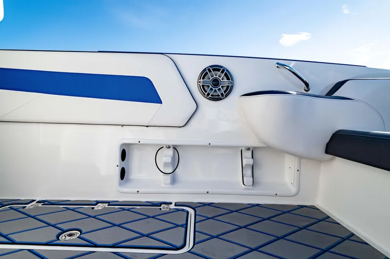 Slide: The Image of 2020 Sunsation 32 CCX boat interior with open storage compartment and stylish flooring. - 19