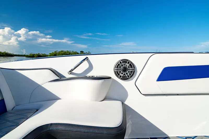 Slide: The Image of 2020 Sunsation 32 CCX boat interior with blue accents and speaker detail. - 20