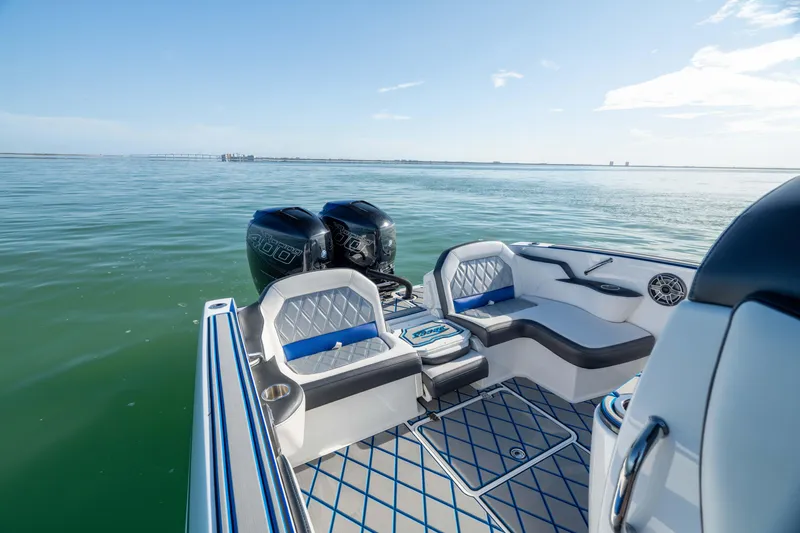 Slide: The Image of 2020 Sunsation 32 CCX boat on calm water with clear blue sky. - 22