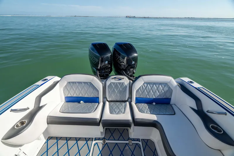 Slide: The Image of 2020 Sunsation 32 CCX boat with dual engines, luxurious seating, and ocean view. - 24