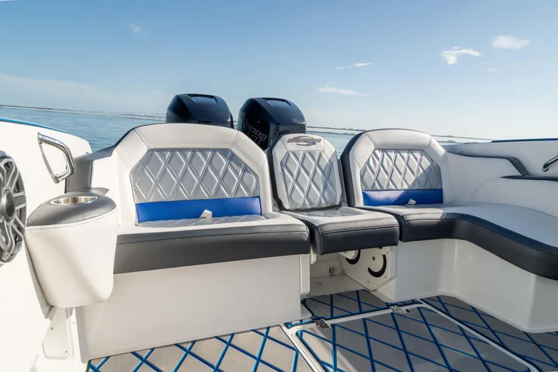 Slide: The Image of 2020 Sunsation 32 CCX boat interior with luxurious seating and ocean backdrop. - 25