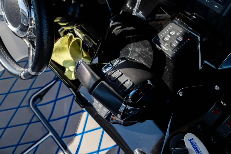 Slide: The Image of Control panel of 2020 Sunsation 32 CCX boat with steering wheel and throttle. - 33