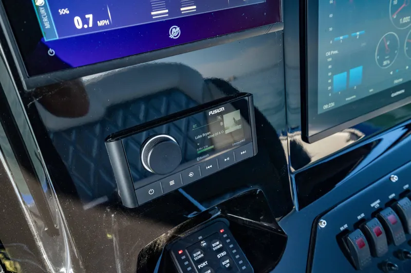 Slide: The Image of 2020 Sunsation 32 CCX dashboard with Fusion audio system and digital displays. - 39