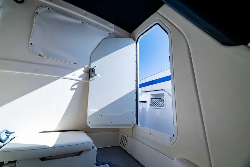 Slide: The Image of Interior cabin of 2020 Sunsation 32 CCX boat with open door and seating. - 41