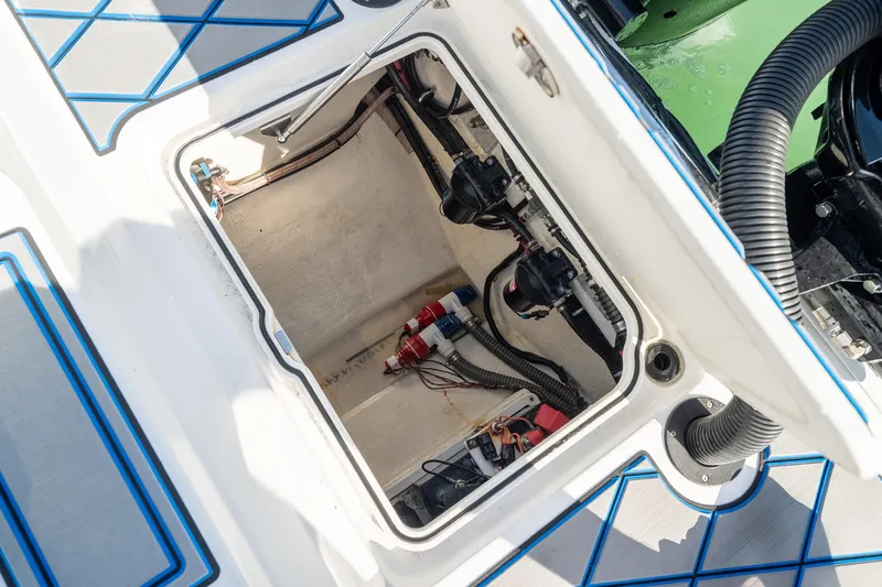 Slide: The Image of 2020 Sunsation 32 CCX boat compartment with visible wiring and components. - 42