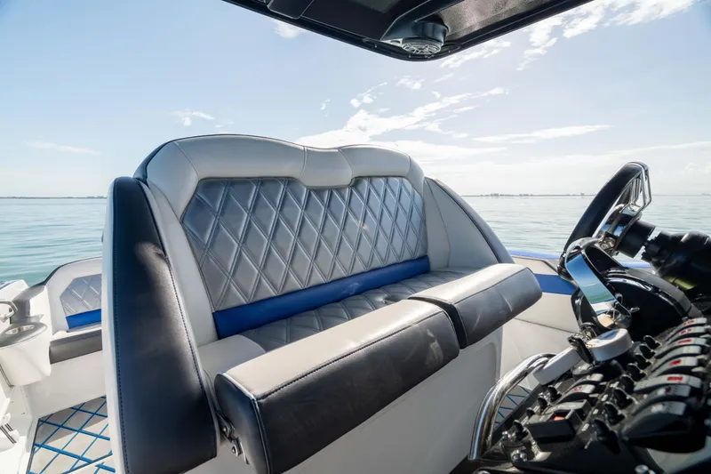 Slide: The Image of 2020 Sunsation 32 CCX boat interior with luxurious seating and open sea view. - 6