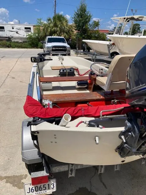 Slide: The Image of 1980 Boston Whaler 13 boat on trailer, outdoor setting, sunny day. - 3