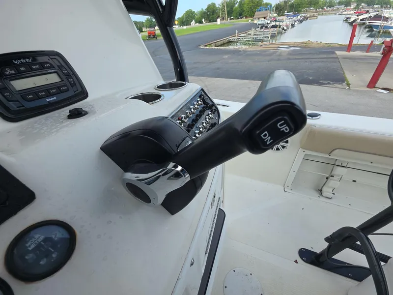 Slide: The Image of Control panel of a 2018 NauticStar 22 XS Offshore boat at a marina. - 8