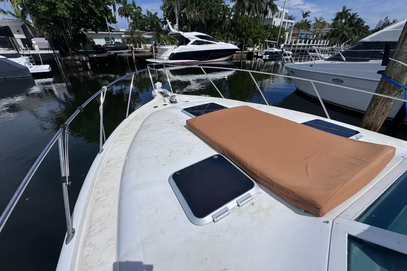 Slide: The Image of 2001 Tiara Yachts 3100 Open with sunpad, docked in a marina. - 26
