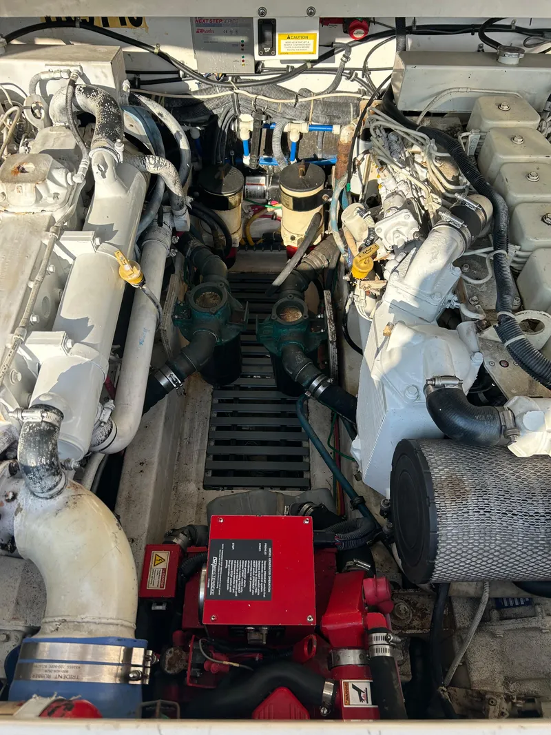 Slide: The Image of Engine compartment of a 2001 Tiara Yachts 3100 Open, showcasing dual engines and components. - 49