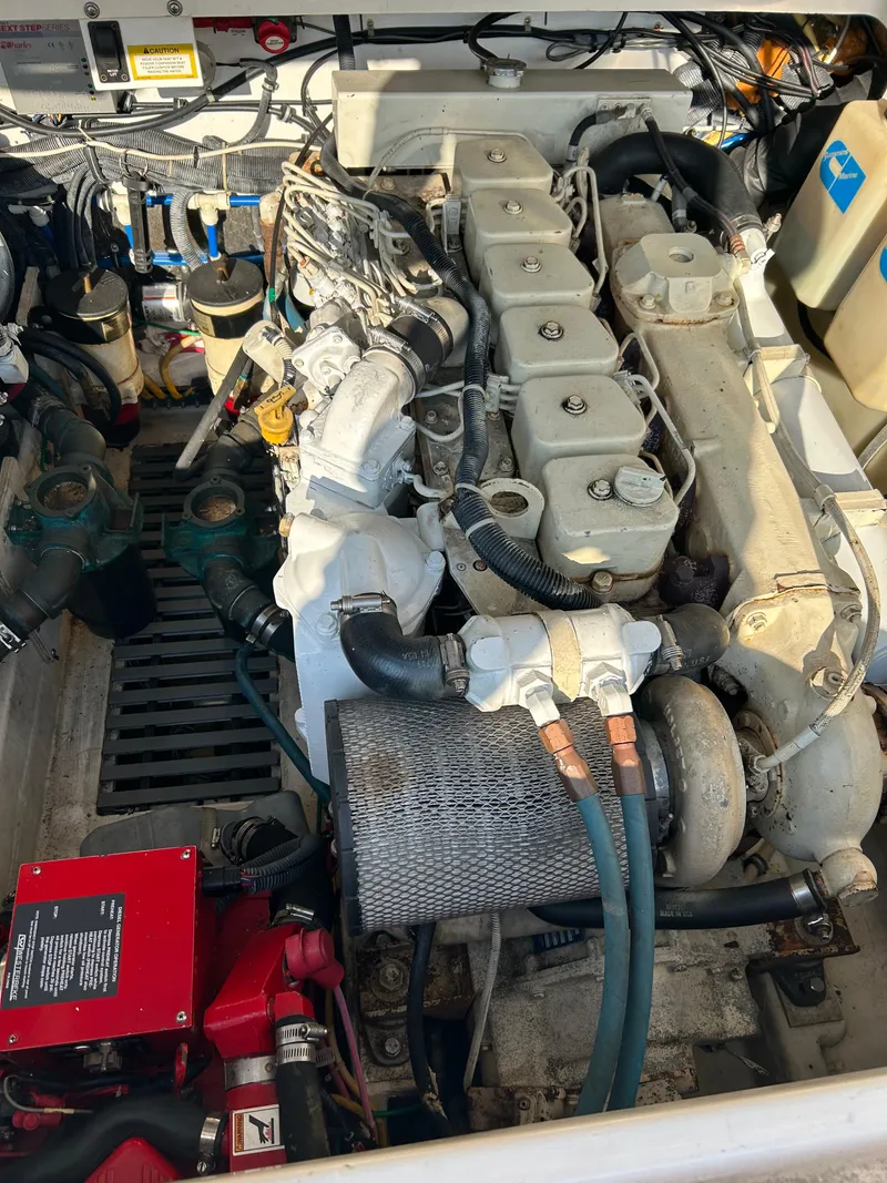 Slide: The Image of Engine compartment of a 2001 Tiara Yachts 3100 Open, showcasing mechanical components. - 51