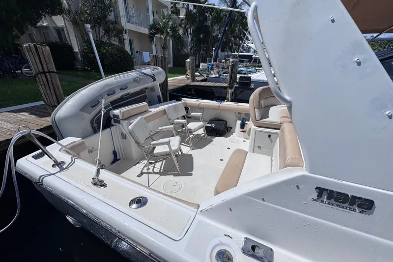Slide: The Image of 2001 Tiara Yachts 3100 Open boat with seating and equipment at a dock. - 6