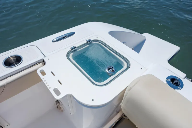Slide: The Image of 2018 Pursuit C 238 Center Console boat with livewell and cup holder on deck. - 12