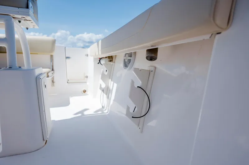 Slide: The Image of 2018 Pursuit C 238 Center Console boat interior with seating and storage compartments. - 20