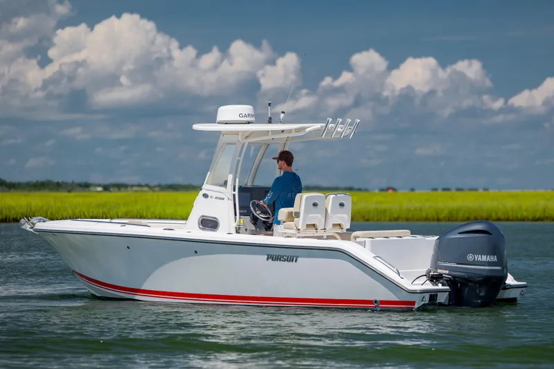 Slide: The Image of 2018 Pursuit C 238 Center Console boat on water with Yamaha engine. - 5