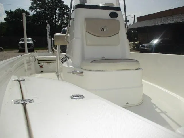 Slide: The Image of 2017 NauticStar 2140 Sport boat interior with console and seating. - 2