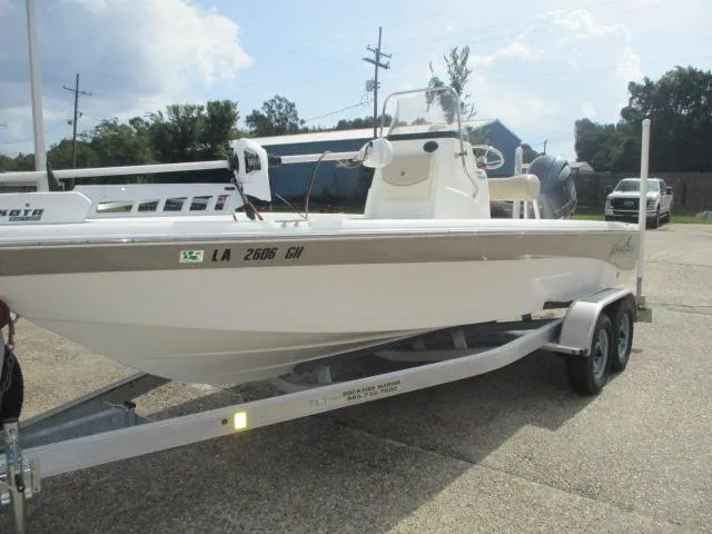 Slide: The Image of 2017 NauticStar 2140 Sport boat on trailer, parked outdoors. - 4