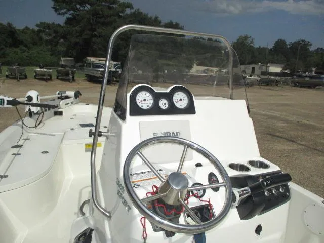 Slide: The Image of 2017 NauticStar 2140 Sport boat dashboard with steering wheel and gauges. - 6