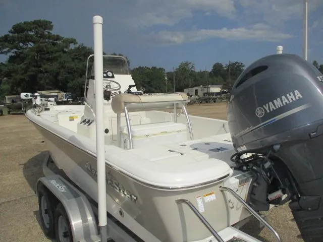 Slide: The Image of 2017 NauticStar 2140 Sport boat with Yamaha engine on trailer, parked outdoors. - 8
