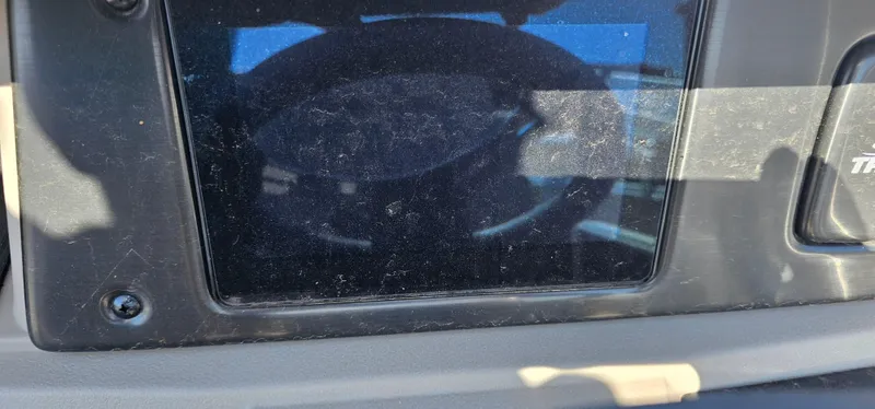 Slide: The Image of Dashboard of a 2024 Sun Tracker SportsFish 20 DLX boat, featuring a steering wheel. - 12