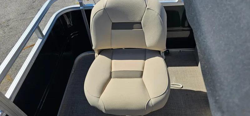 Slide: The Image of 2024 Sun Tracker SportsFish 20 DLX boat seat, beige upholstery, outdoor setting. - 16