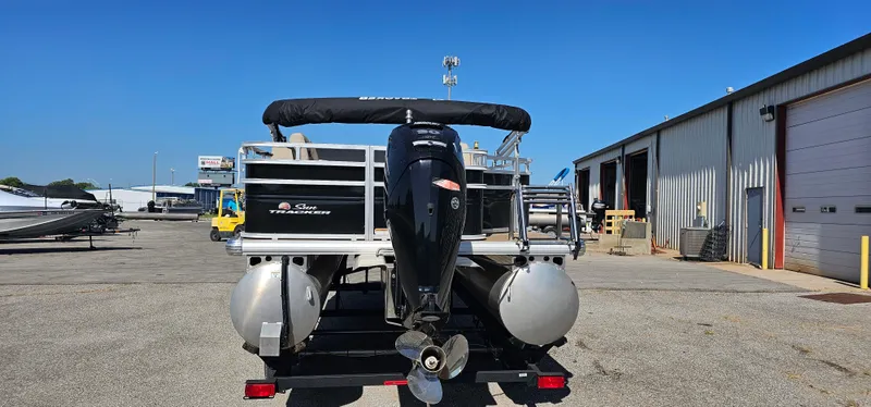 Slide: The Image of 2024 Sun Tracker SportsFish 20 DLX pontoon boat, rear view, parked at a marina. - 3