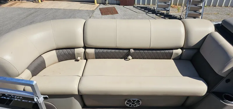 Slide: The Image of 2024 Sun Tracker SportsFish 20 DLX boat seating with beige upholstery and diamond-pattern accents. - 8