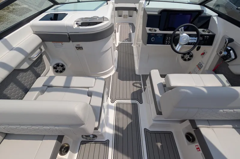 Slide: The Image of Luxurious interior of 2025 Sea Ray SDX 290 boat with modern seating and controls. - 10