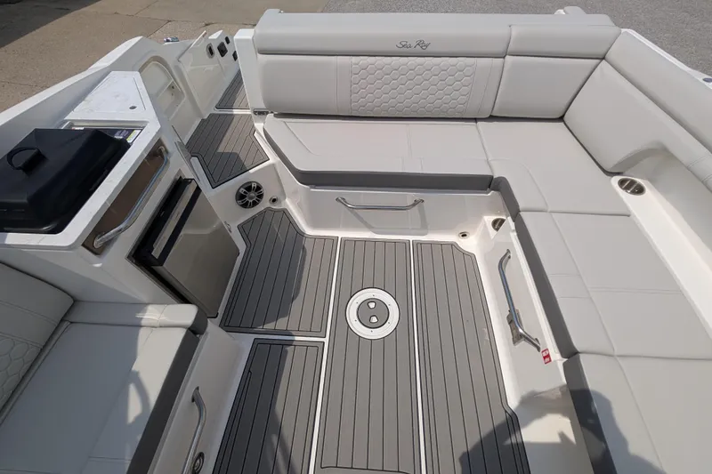 Slide: The Image of 2025 Sea Ray SDX 290 boat interior with sleek seating and modern amenities. - 14
