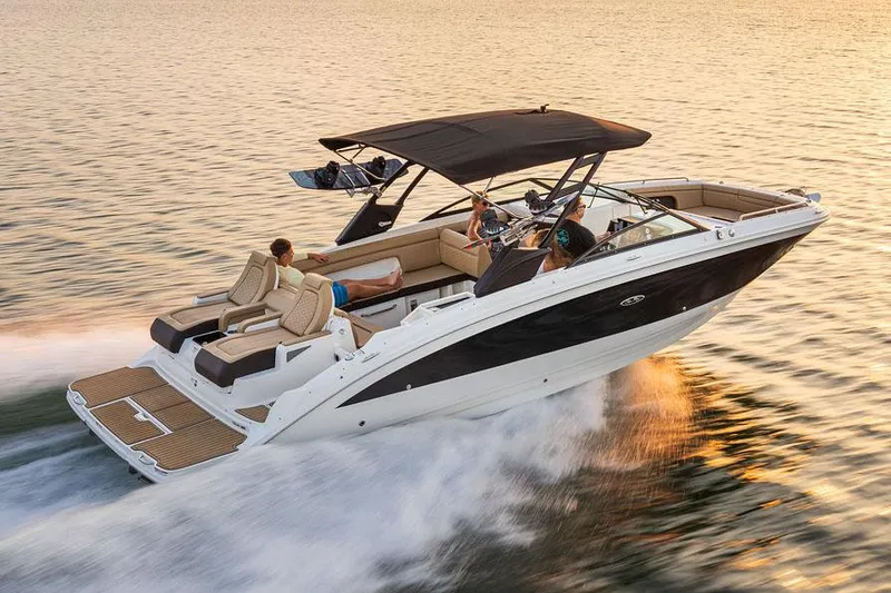 Slide: The Image of Manufacturer Provided Image: 2025 Sea Ray SDX 290 cruising on water at sunset, featuring sleek design and spacious seating. - 35