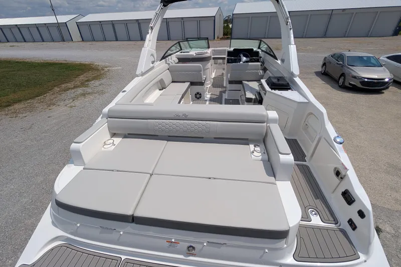 Slide: The Image of 2025 Sea Ray SDX 290 boat with spacious seating and modern design. - 7