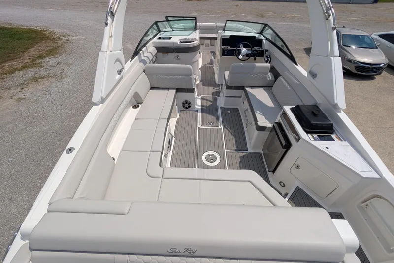 Slide: The Image of 2025 Sea Ray SDX 290 boat interior with spacious seating and modern amenities. - 8