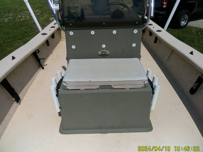 Slide: The Image of 2002 Intruder 20 Skiff boat interior with seating and rod holders. - 10