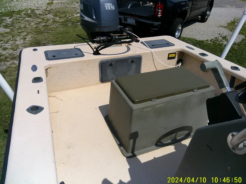 Slide: The Image of 2002 Intruder 20 Skiff boat interior with Yamaha 115 outboard motor. - 14