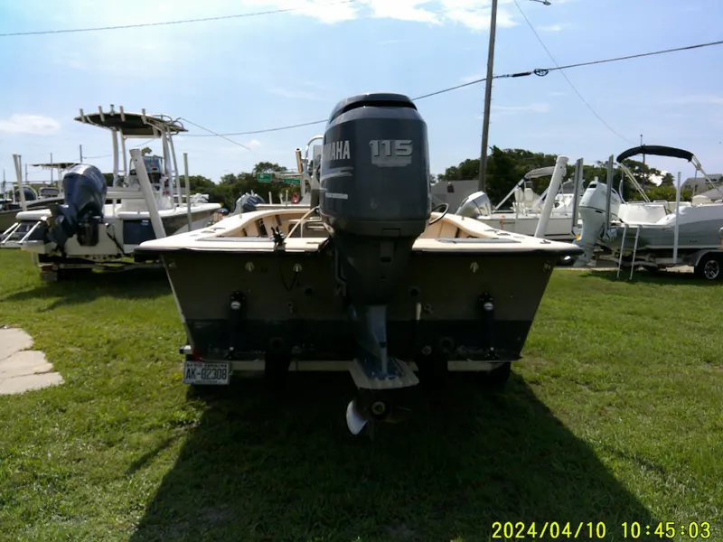 Slide: The Image of 2002 Intruder 20 Skiff with Yamaha 115 outboard motor on grassy lot. - 4