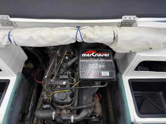 Slide: The Image of Engine compartment of a 1991 Larson All American 170 with MerCruiser Alpha One drive. - 14