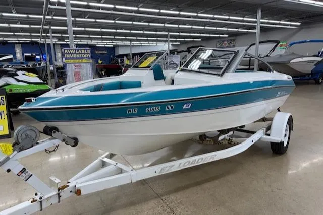 Slide: The Image of 1991 Larson All American 170 boat on trailer in showroom. - 6