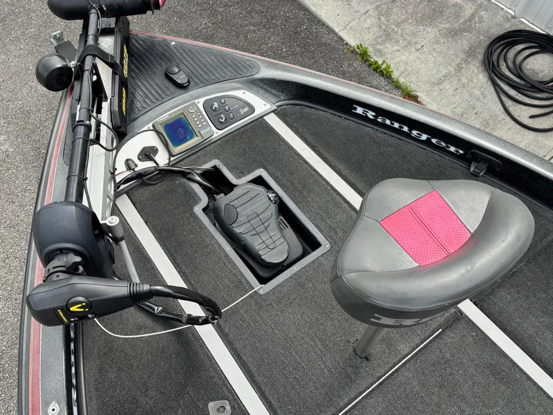 Slide: The Image of 2006 Ranger Z19 Comanche boat interior with seat, foot pedal, and control panel. - 4