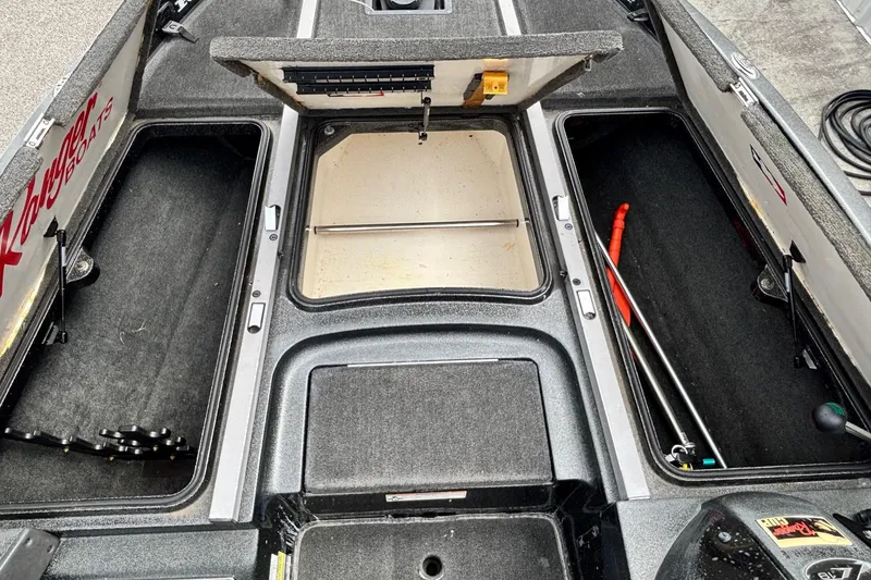Slide: The Image of 2006 Ranger Z19 Comanche boat interior storage compartments, open and empty. - 5
